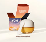 YOM 528 Loving Lip Mask jar with a white lid and scoop, shown next to its open biodegradable packaging box on a clean white background.