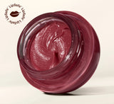 Open glass jar showing rich berry-tinted YOM Beauty lip balm formula with LipSafe certification logo in top corner.
